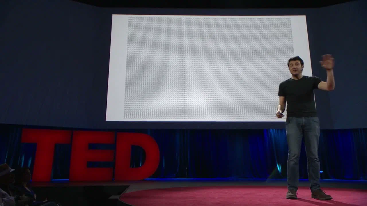 Тим Урбан на сцене TED на фоне календаря жизни — сетки, где каждая клетка равна одной неделе